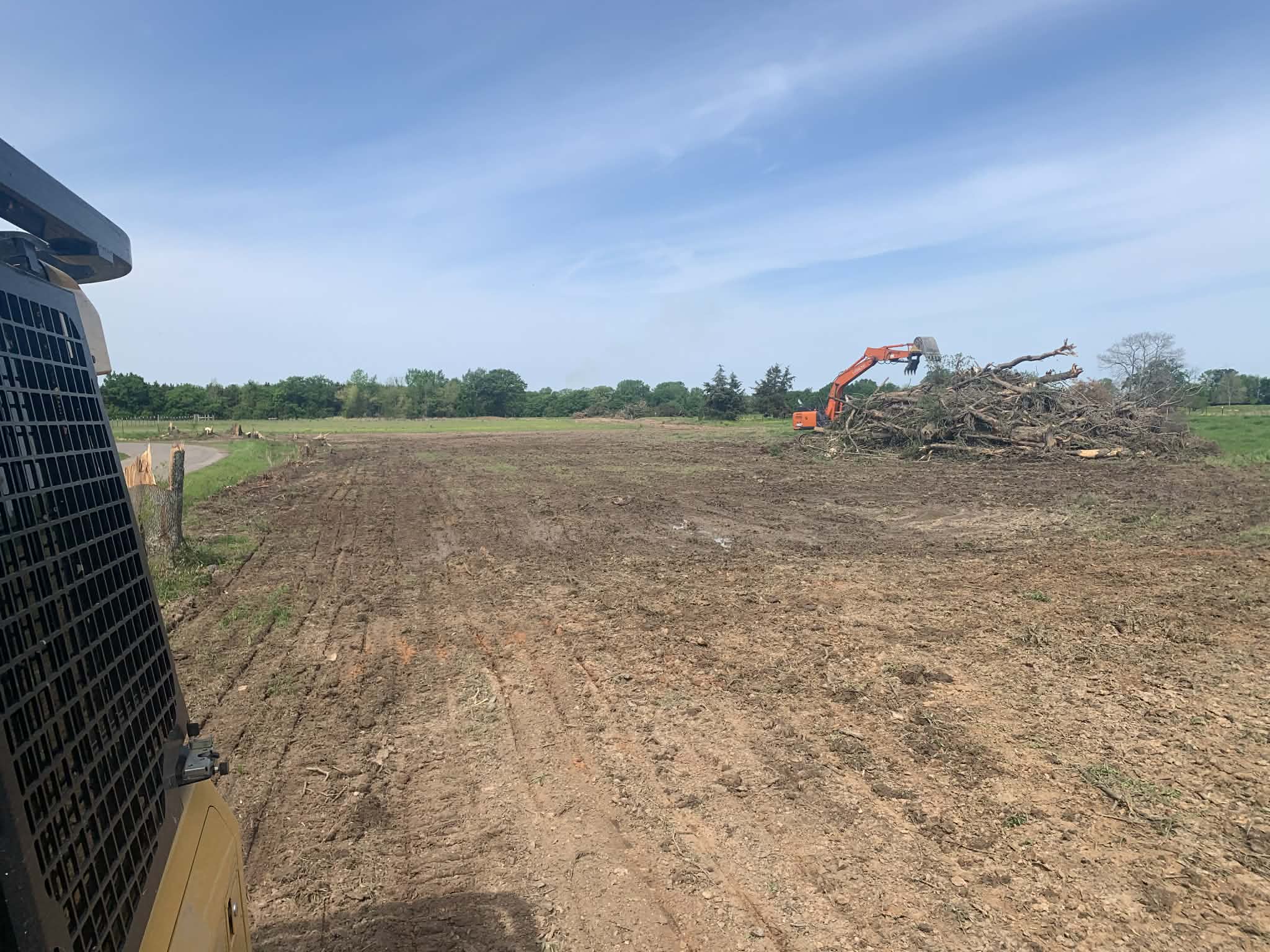 Land clearing with excavator and equipment